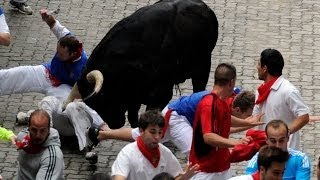 Two Gored in Spains Pamplona Bull Run [upl. by Elletsyrk]